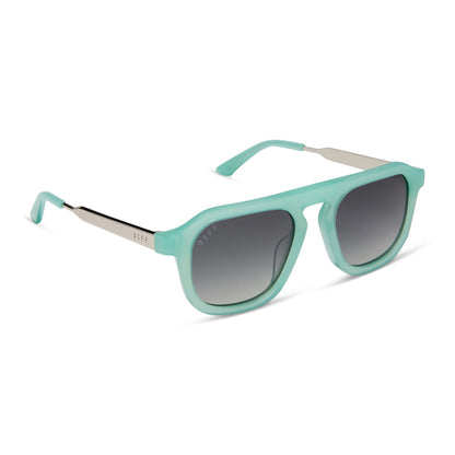 jena sims x diff eyewear featuring the sims navigator sunglasses with a bronco blue with silver metal frame and grey gradient polarized lenses angled view