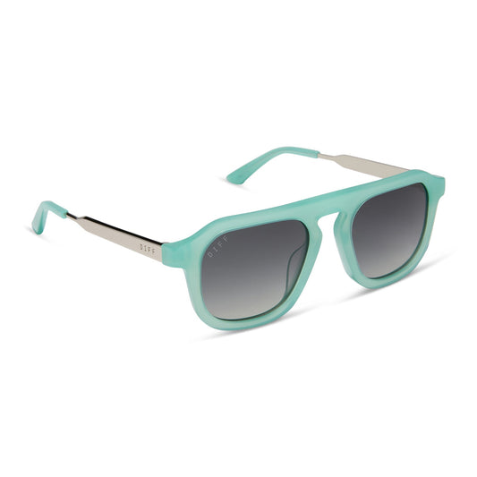 jena sims x diff eyewear featuring the sims navigator sunglasses with a bronco blue with silver metal frame and grey gradient polarized lenses angled view
