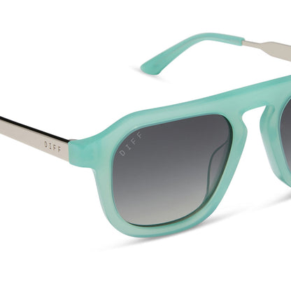 jena sims x diff eyewear featuring the sims navigator sunglasses with a bronco blue with silver metal frame and grey gradient polarized lenses detailed view