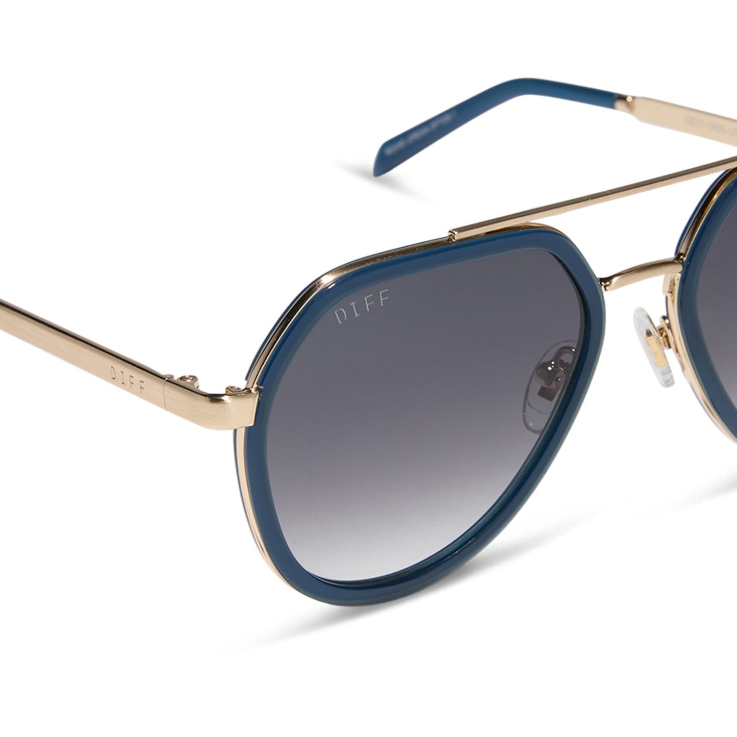 diff eyewear featuring the joey round sunglasses with a clubhouse blue & brushed gold metal frame with grey gradient lenses detailed view