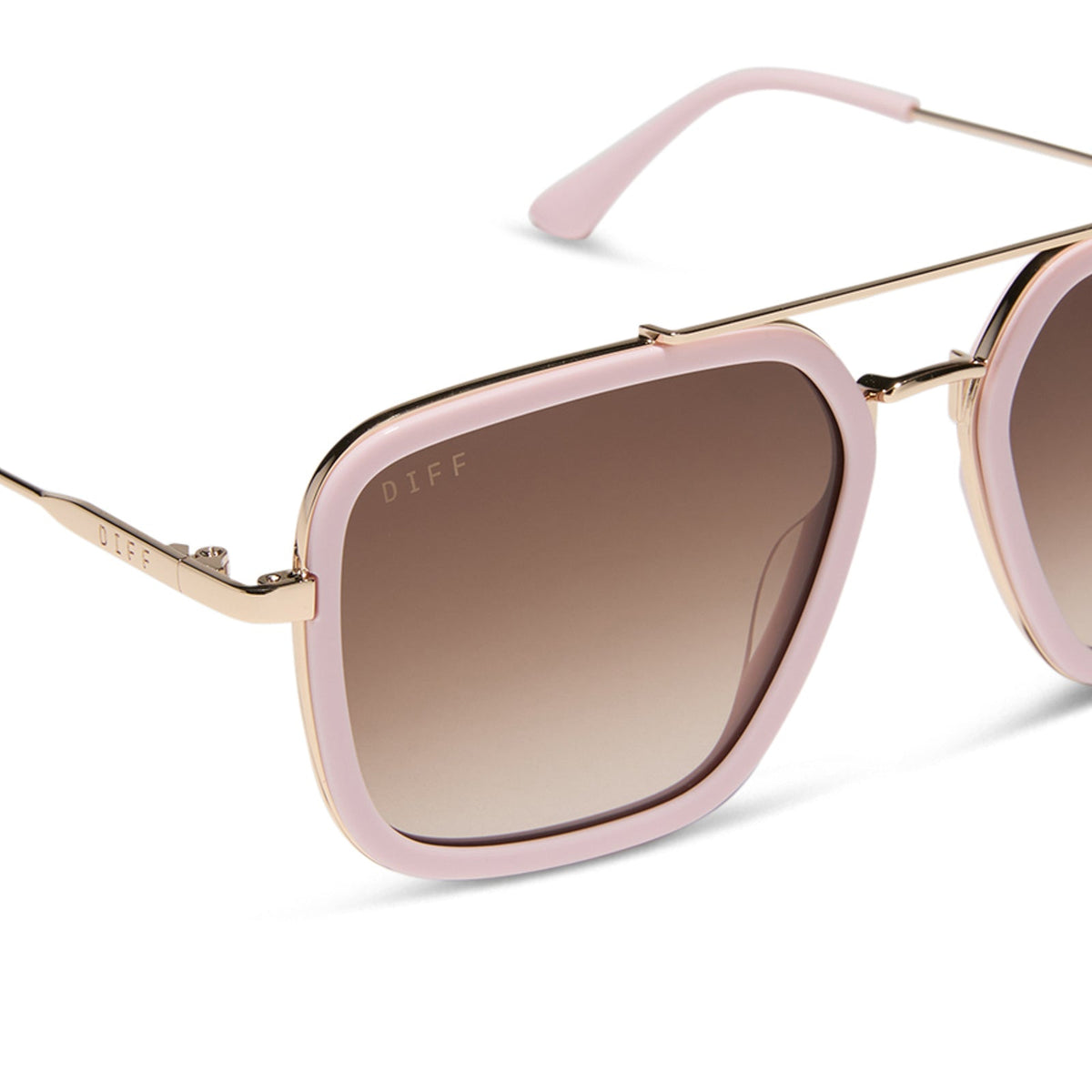 diff eyewear featuring the jordan navigator sunglasses with a powder pink with gold frame and brown gradient lenses detailed view