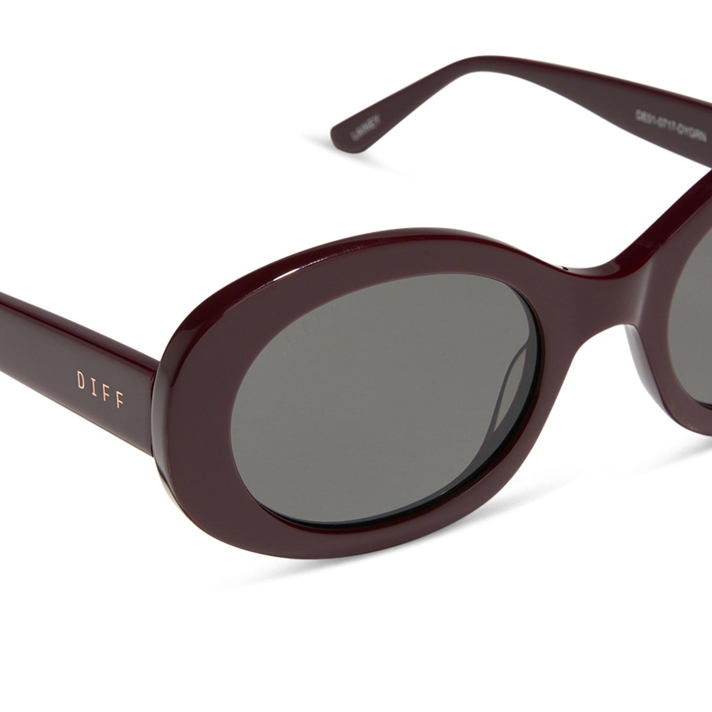 diff eyewear featuring the lainey oval sunglasses with a dark cherry lacquer frame and grey lenses detailed view