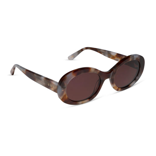 diff eyewear lainey oval sunglasses with a dove tortoise acetate frame and brown polarized lenses angled view