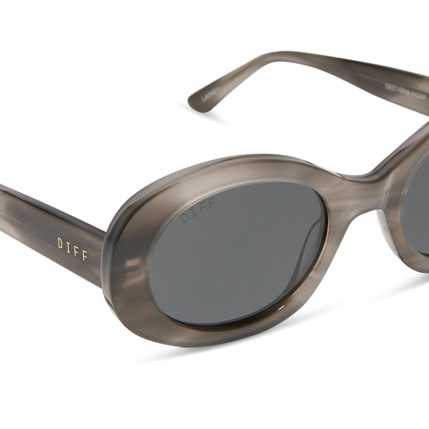 diff eyewear featuring the lainey oval sunglasses with a smoke marble frame and grey polarized lenses detailed view