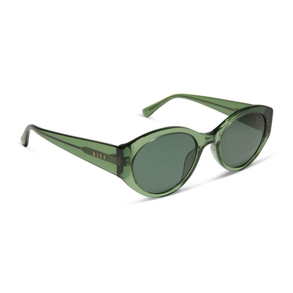 diff eyewear featuring the linnea oval sunglasses with a sage green crystal frame and g15 polarized lenses angled view