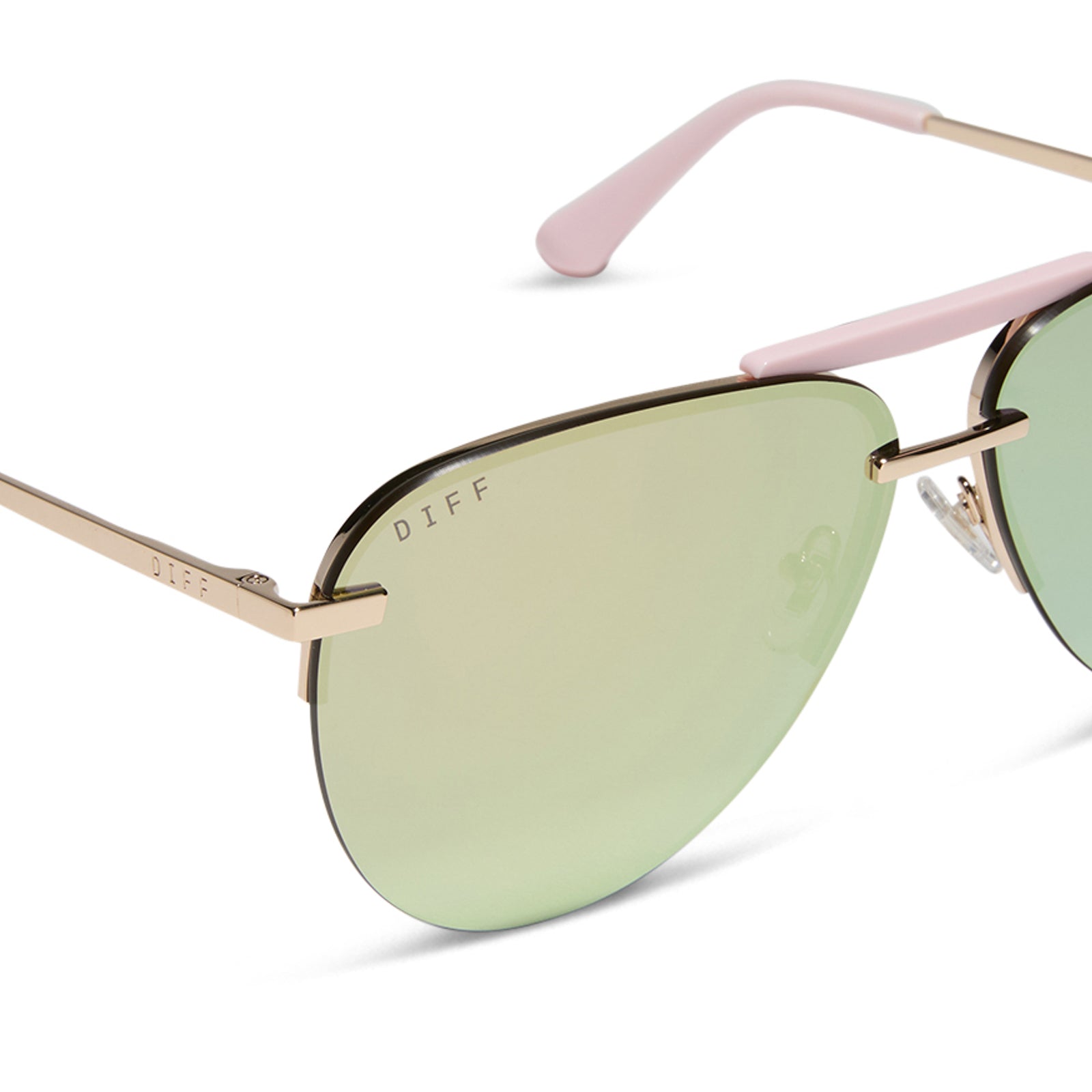 diff eyewear featuring the tahoe aviator sunglasses with a gold with powder pink brow bar & temple tips frame and taupe mirror lenses detailed view
