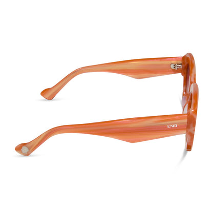 wednesday x diff eyewear featuring the enid sinclair cat eye sunglasses with a orange pink stripe frame and wine gradient lenses side view