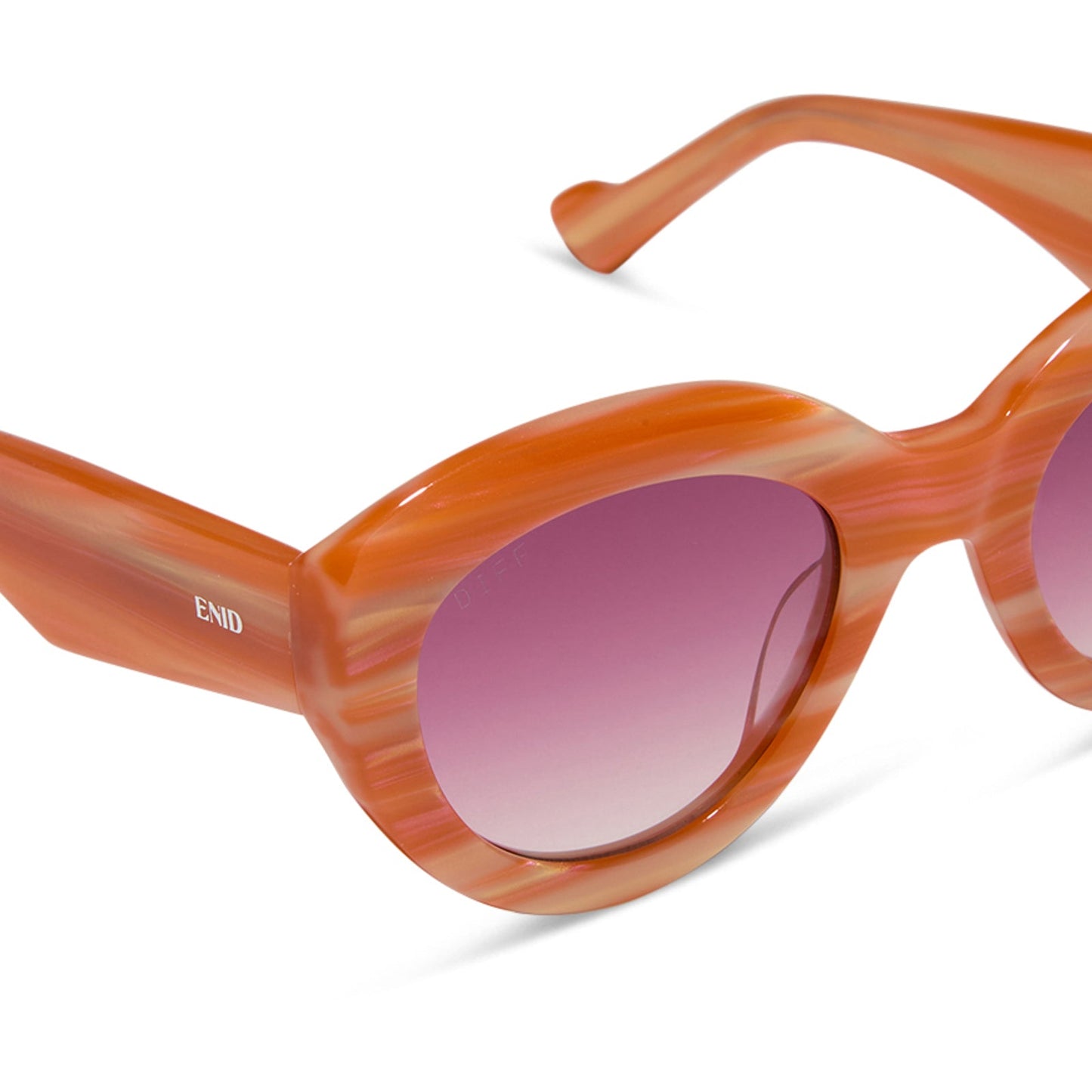 wednesday x diff eyewear featuring the enid sinclair cat eye sunglasses with a orange pink stripe frame and wine gradient lenses angled view