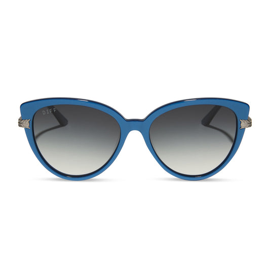 wednesday x diff eyewear featuring the marilyn thornhill cat eye sunglasses with a blue frame and grey gradient lenses front view