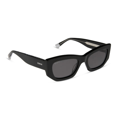 wednesday x diff eyewear featuring the wednesday addams cat eye sunglasses with a black frame and grey lenses angled view