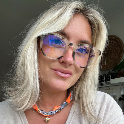 customer content - blonde female wearing cream tort blue light glasses