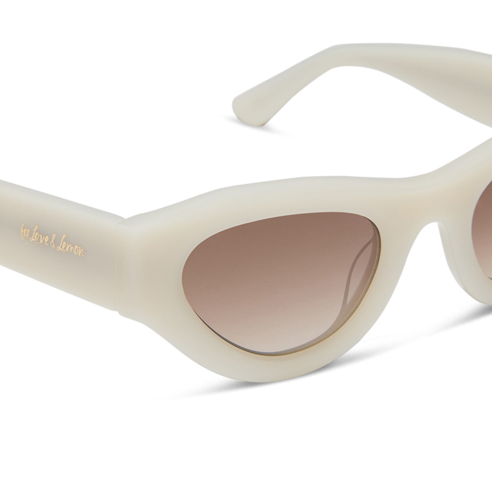 for love and lemons x diff eyewear featuring the lucy cat eye sunglasses with a meringue cream frame and brown gradient lenses detailed view