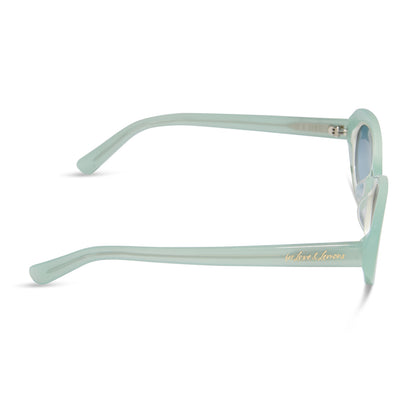for love and lemons x diff eyewear featuring the sabrina oval sunglasses with a pastel sage frame and blue gradient lenses side view