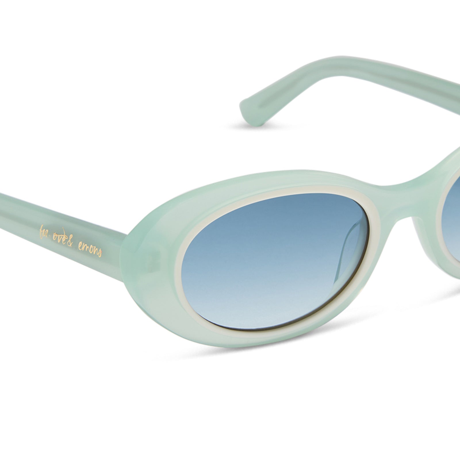 for love and lemons x diff eyewear featuring the sabrina oval sunglasses with a pastel sage frame and blue gradient lenses detailed view